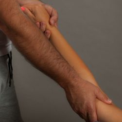Close-up of therapist performing a soothing arm massage promoting relaxation and well-being.